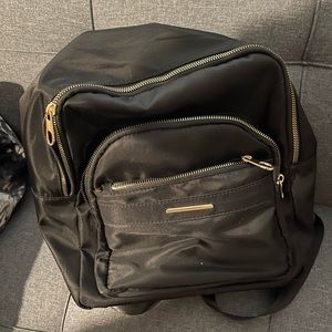Nylon Black back pack in good condition with a crossbody purse